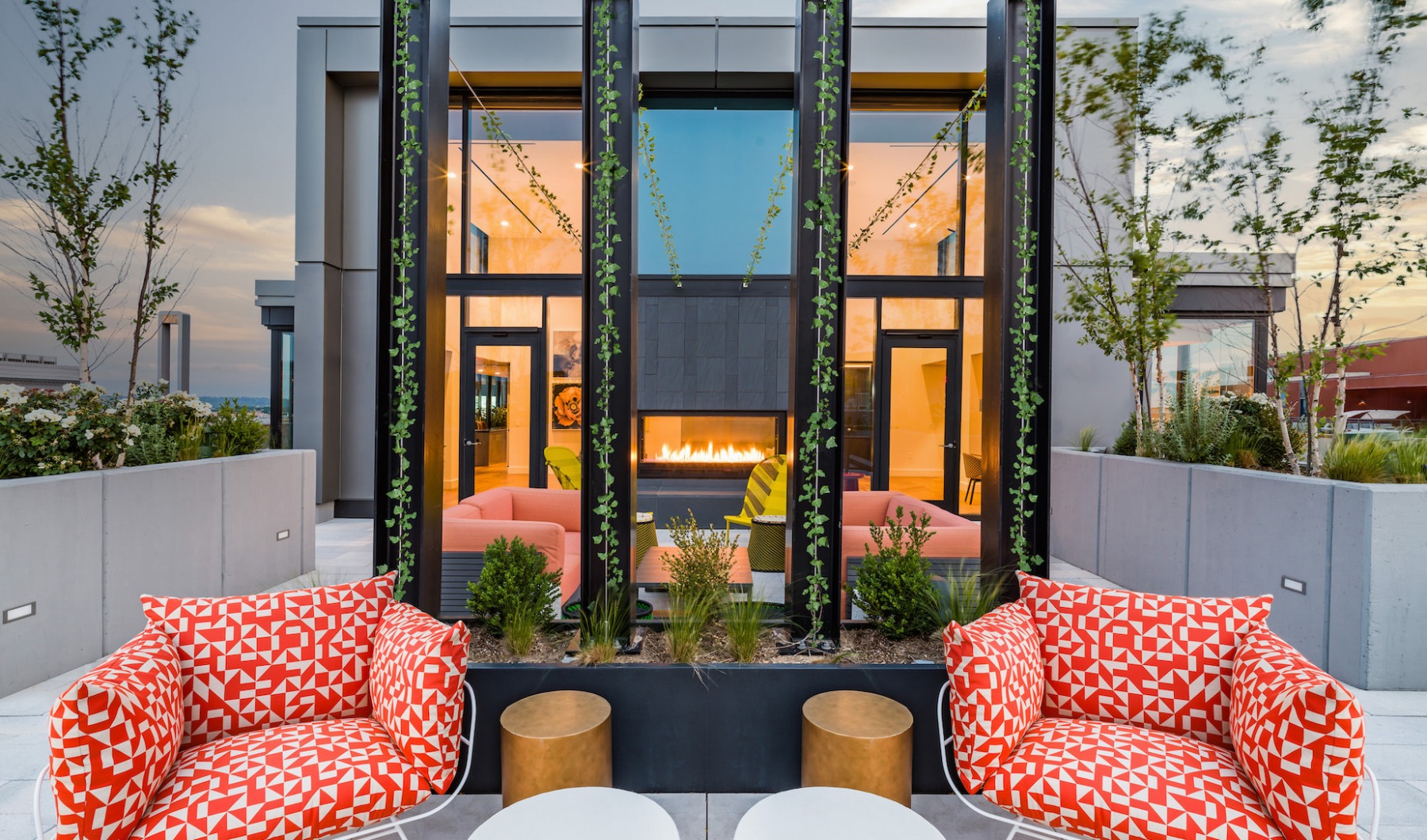 outdoor rooftop vibrant soft seating with view of fireplace